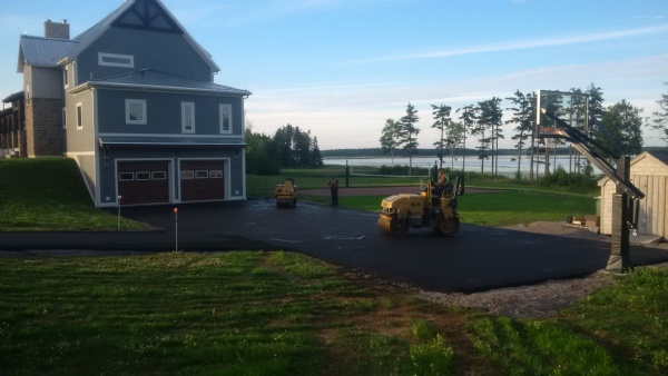 Putting the finishing touches on a residential FINE GRADE & PAVE.